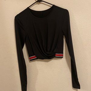 Black fabletics dry fit long sleeve. Slightly cropped. Size xs.